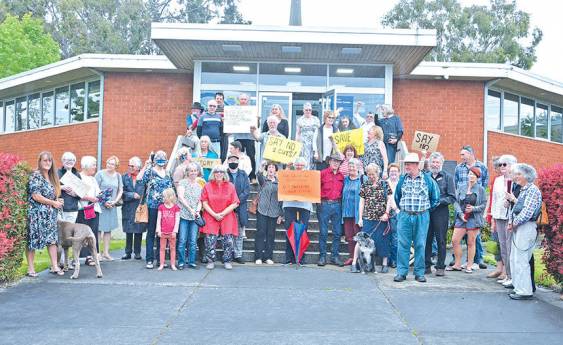 Locals protest library review